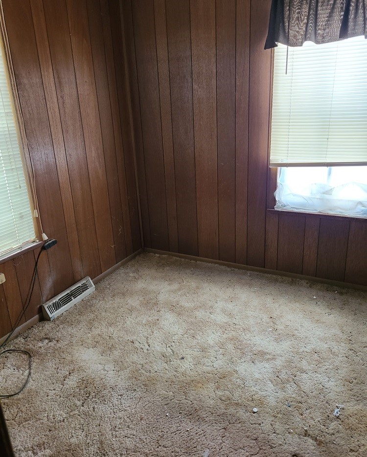 905 Walton Road Dixon, IL 61021 - Photo 9 of 18 a view of an empty room with wooden door