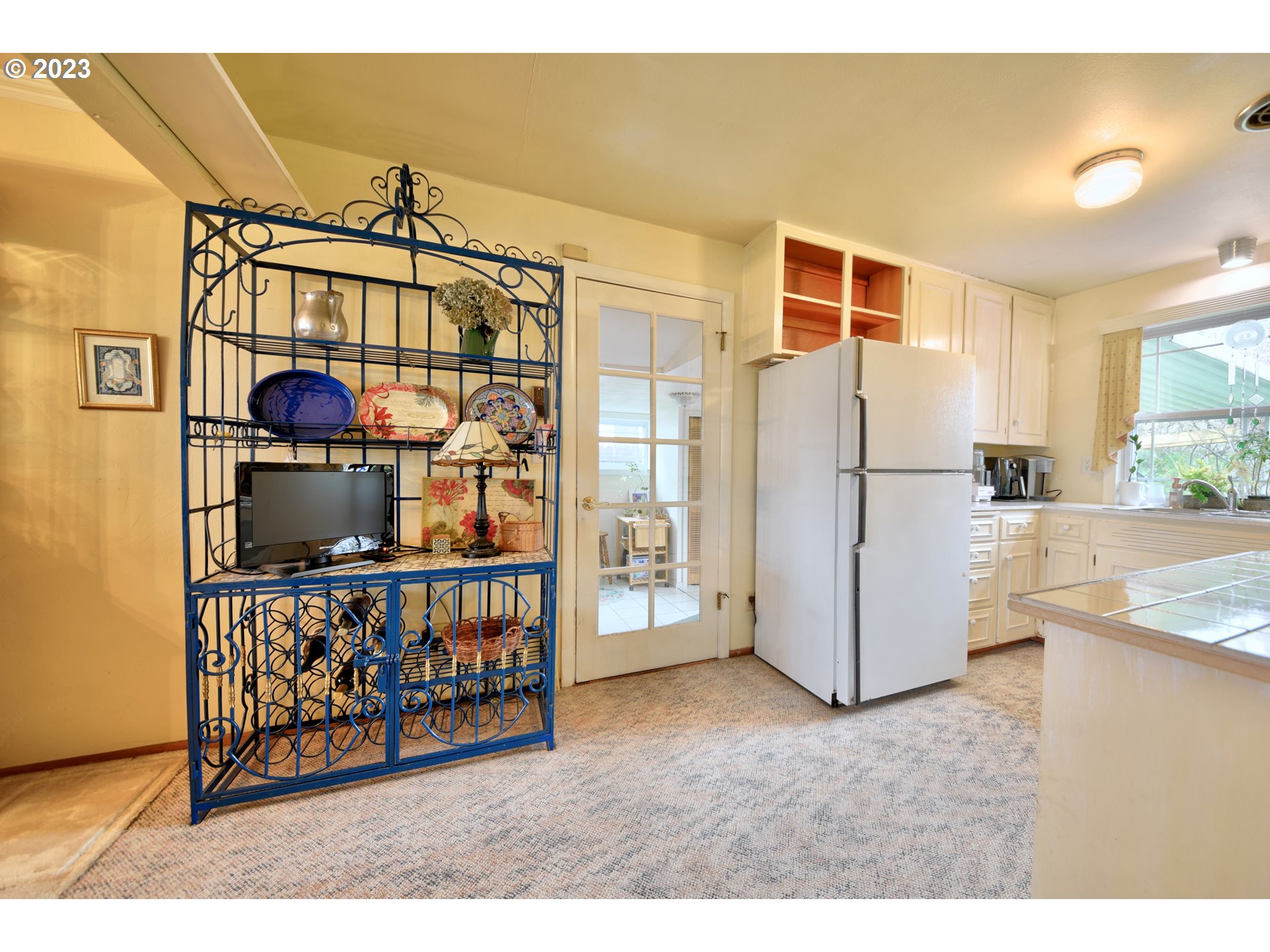 1267 N Street Springfield, OR 97477 - Photo 11 of 27 a kitchen view of a refrigerator and window