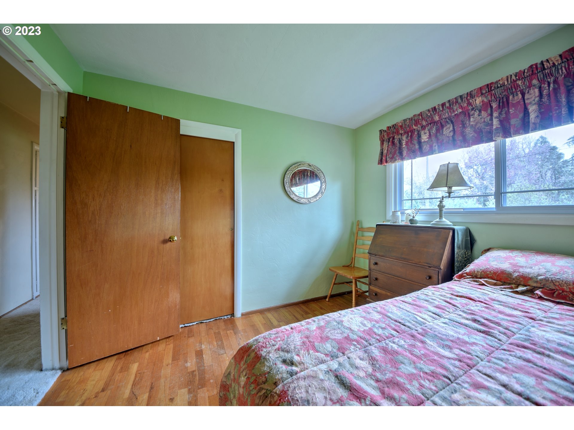 1267 N Street Springfield, OR 97477 - Photo 16 of 27 a bedroom with a bed and window