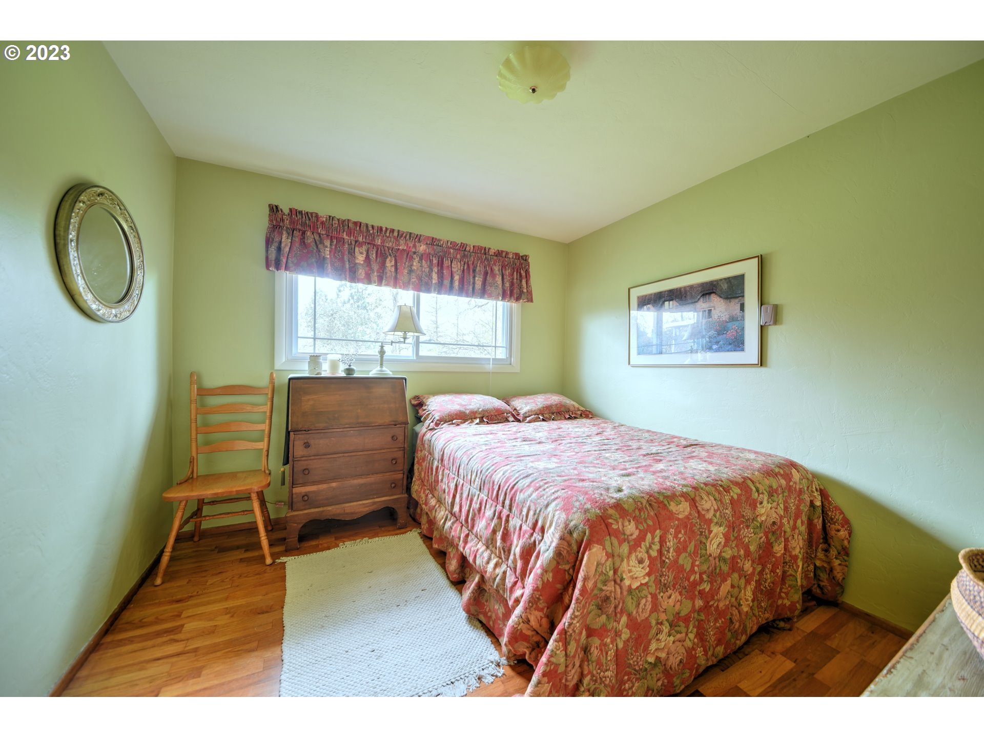 1267 N Street Springfield, OR 97477 - Photo 17 of 27 a bedroom with a bed and a window