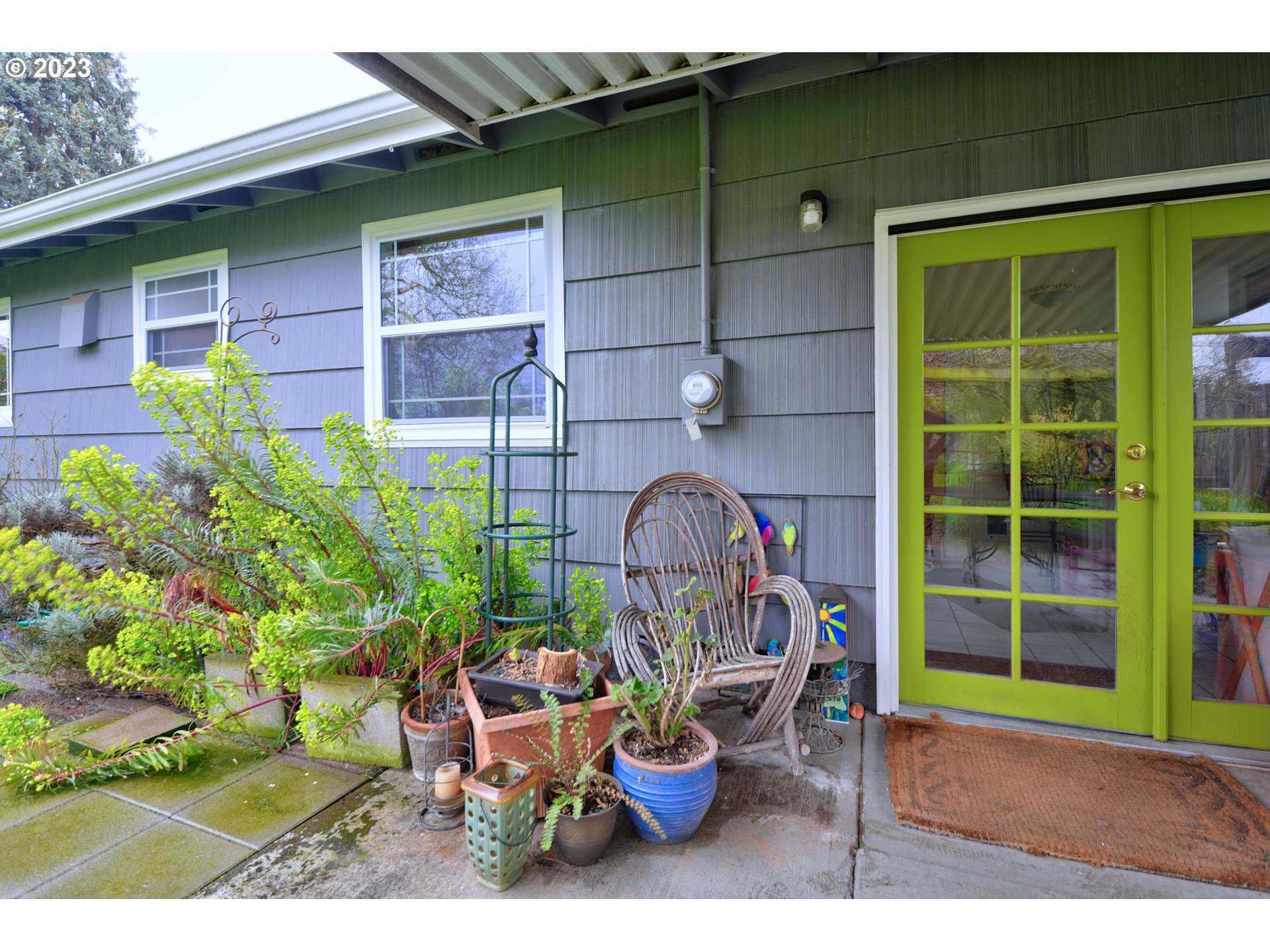 1267 N Street Springfield, OR 97477 - Photo 23 of 27 a backyard of a house with outdoor seating and plants