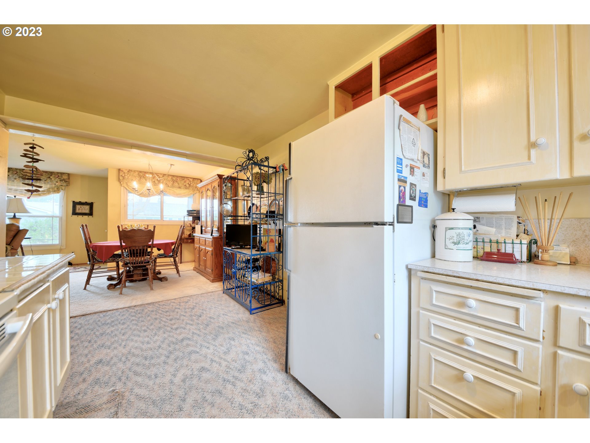 1267 N Street Springfield, OR 97477 - Photo 10 of 27 a kitchen with refrigerator and cabinets