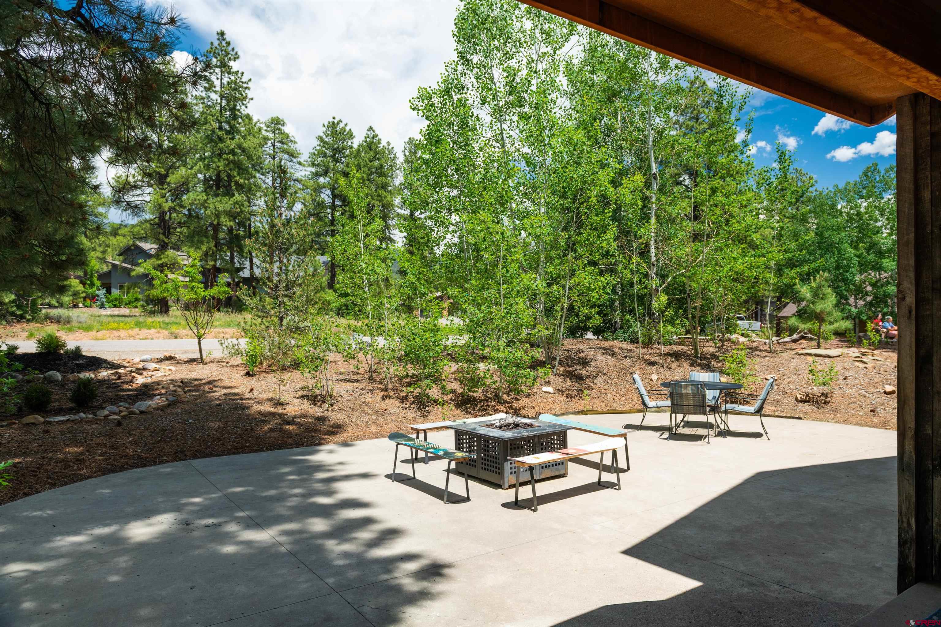 15 Edgemont Way Durango, CO 81301 - Photo 11 of 35 a view of a swimming pool with chairs in a patio