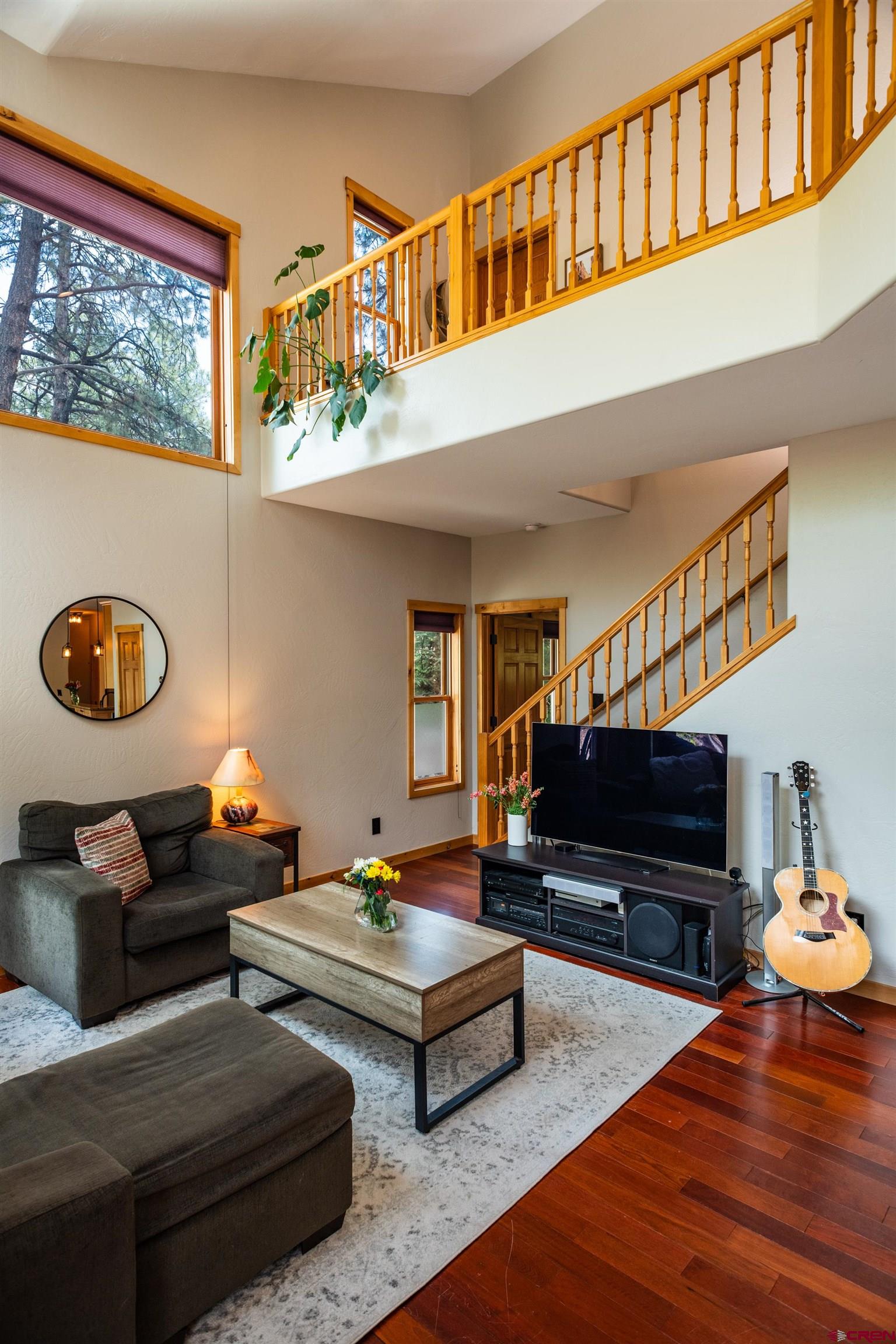 15 Edgemont Way Durango, CO 81301 - Photo 21 of 35 a living room with furniture and a flat screen tv