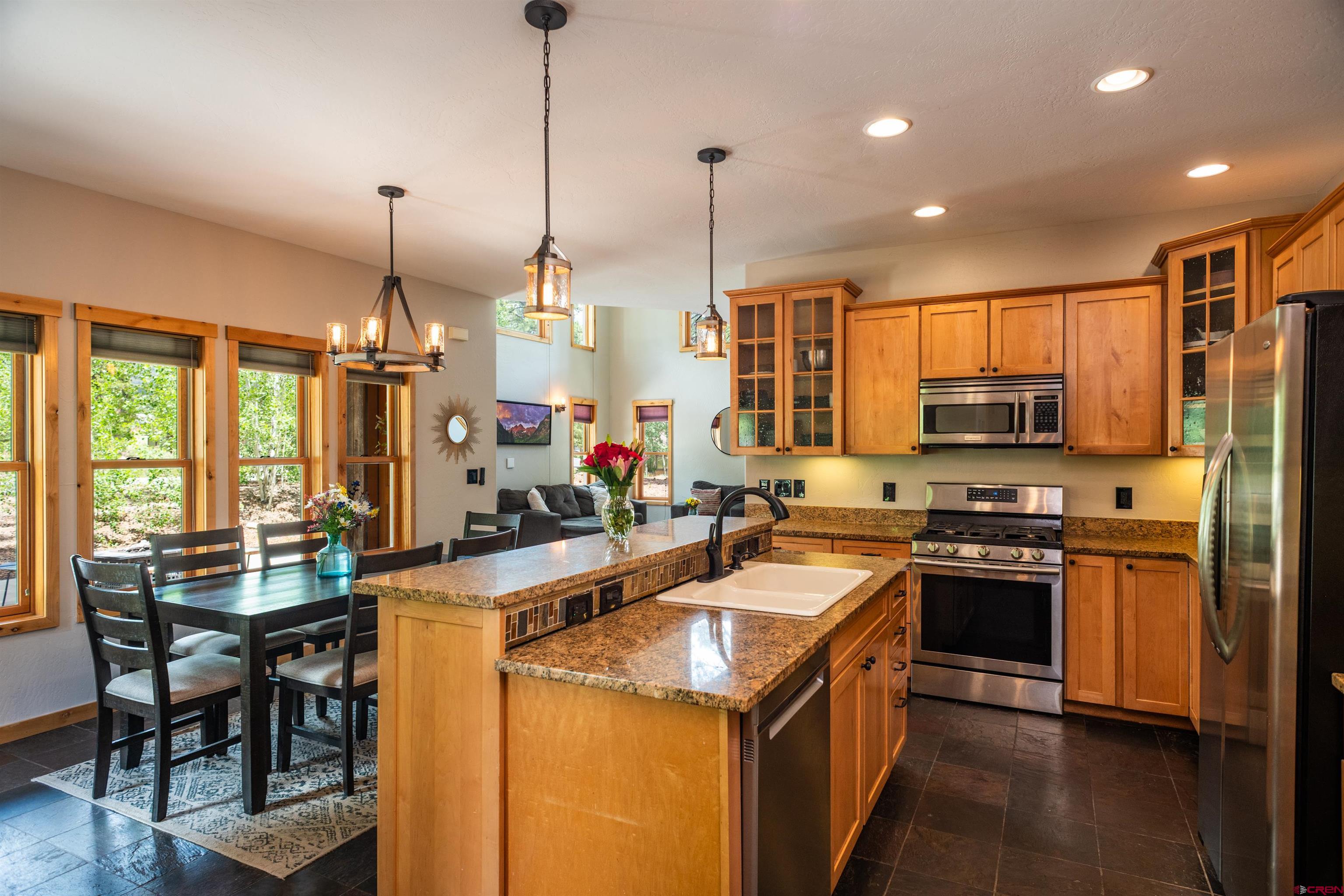 15 Edgemont Way Durango, CO 81301 - Photo 23 of 35 a kitchen with stainless steel appliances granite countertop sink stove top oven and refrigerator