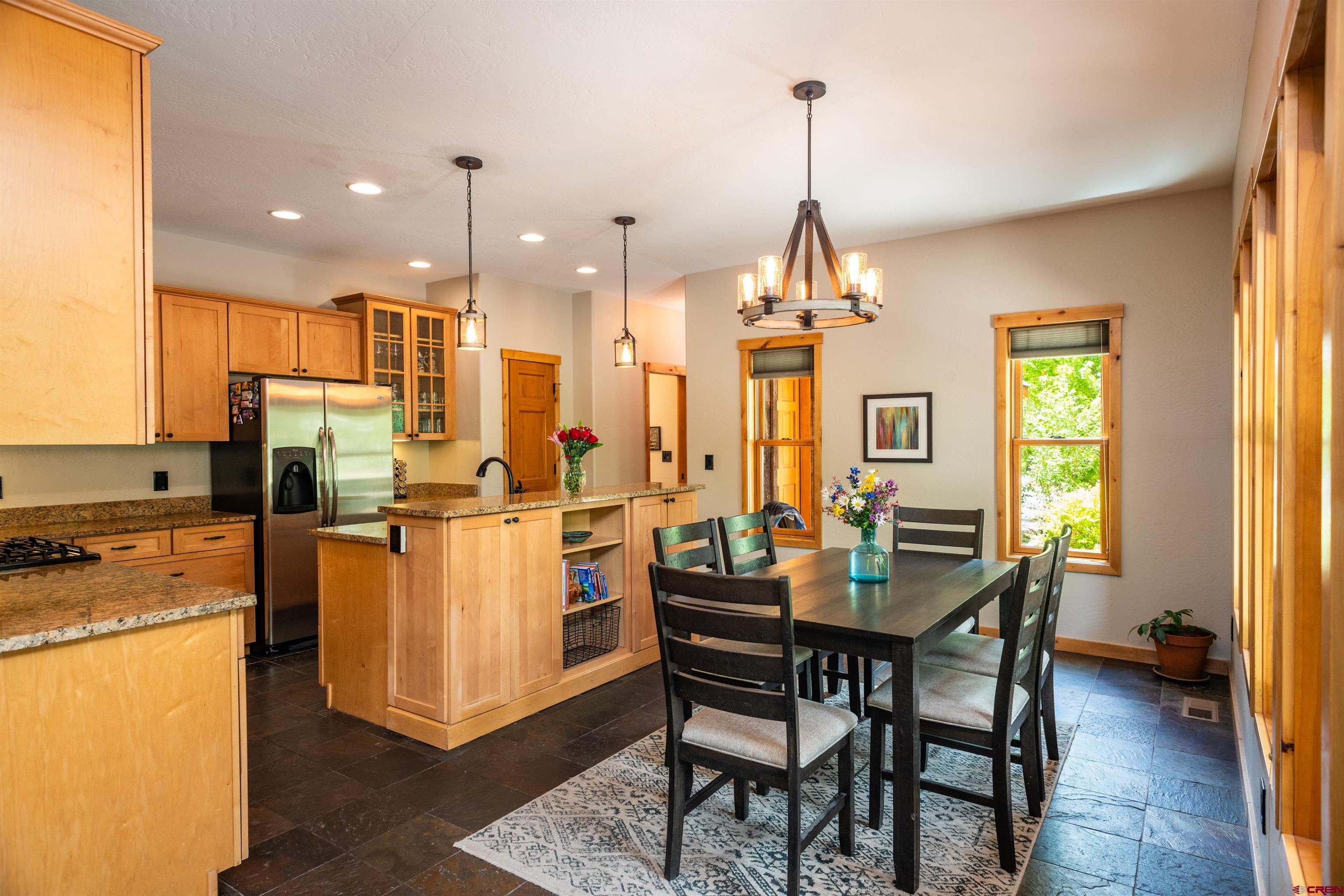15 Edgemont Way Durango, CO 81301 - Photo 24 of 35 a dining room filled with furniture and a chandelier