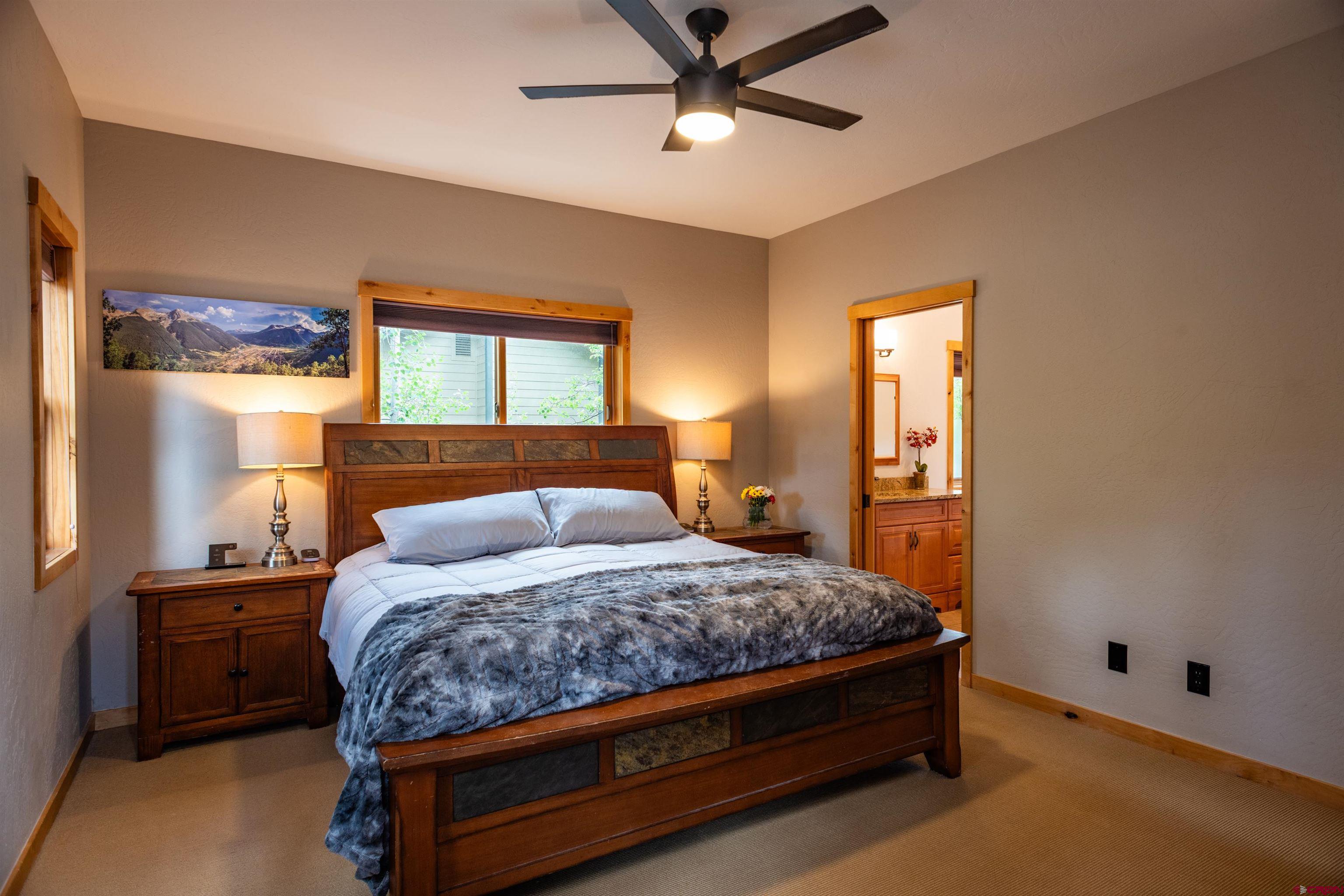15 Edgemont Way Durango, CO 81301 - Photo 25 of 35 a bedroom with a bed and window