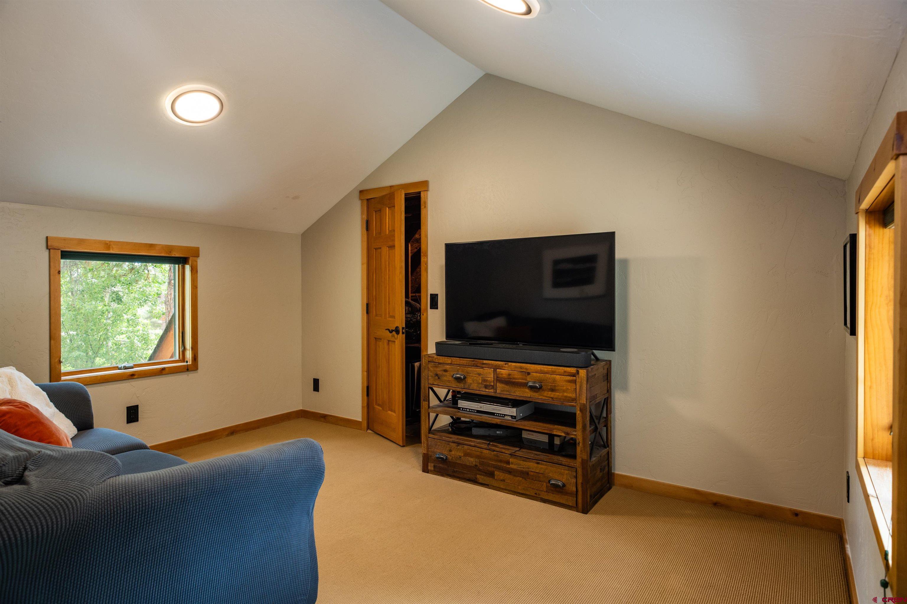 15 Edgemont Way Durango, CO 81301 - Photo 33 of 35 a living room with furniture and a flat screen tv