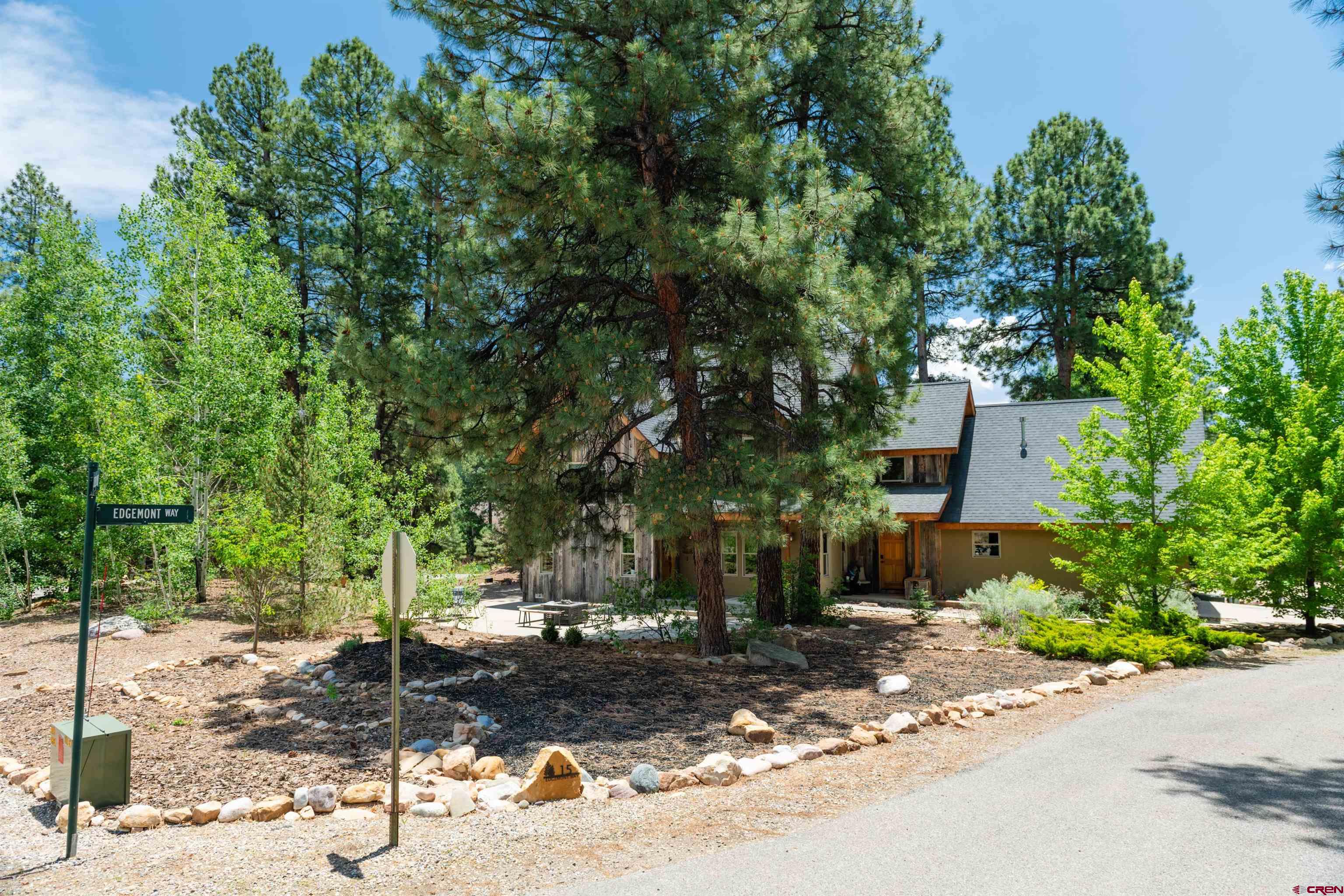 15 Edgemont Way Durango, CO 81301 - Photo 7 of 35 a street view with large trees