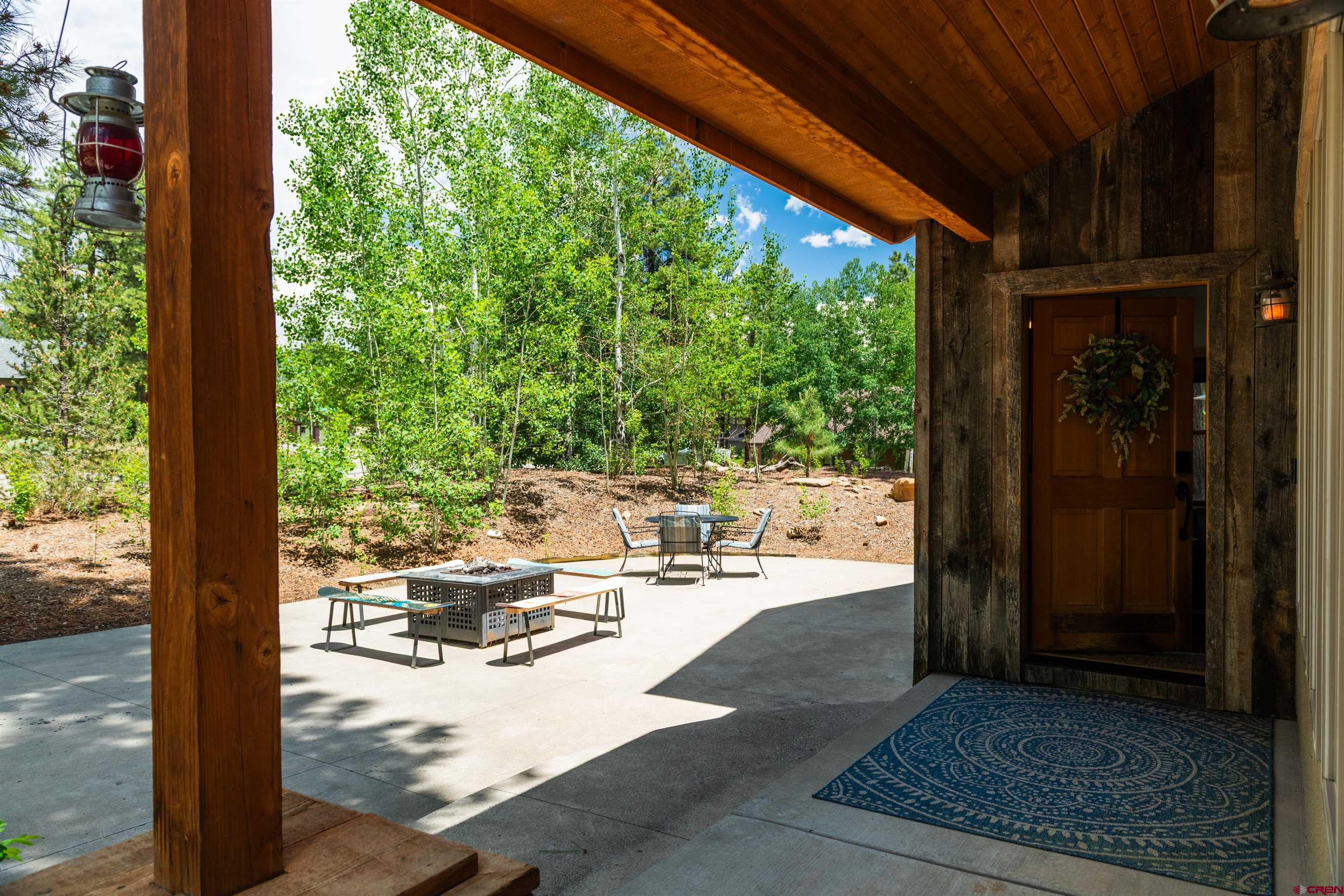 15 Edgemont Way Durango, CO 81301 - Photo 10 of 35 a view of a patio with dining table and chairs