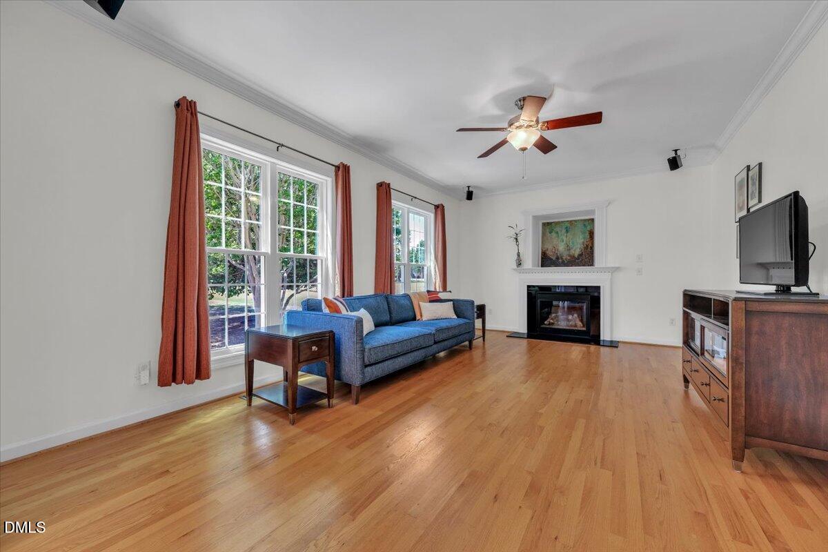 2908 Oak Bridge Drive Raleigh, NC 27610 - Photo 20 of 47 a living room with furniture and a fireplace