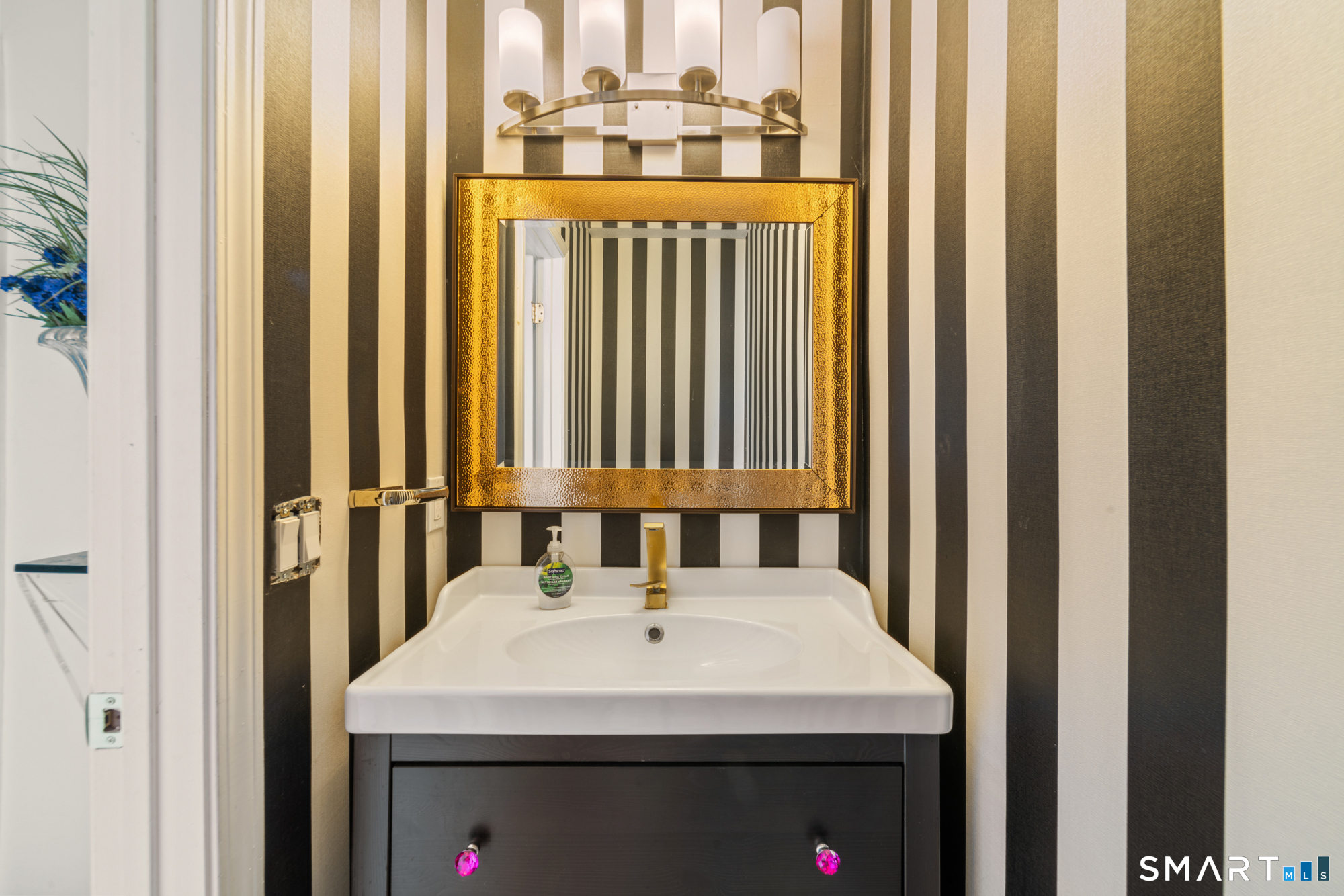 900 Mix Avenue, Unit 123 Hamden, CT 06514 - Photo 14 of 32 a bathroom with a sink and a mirror