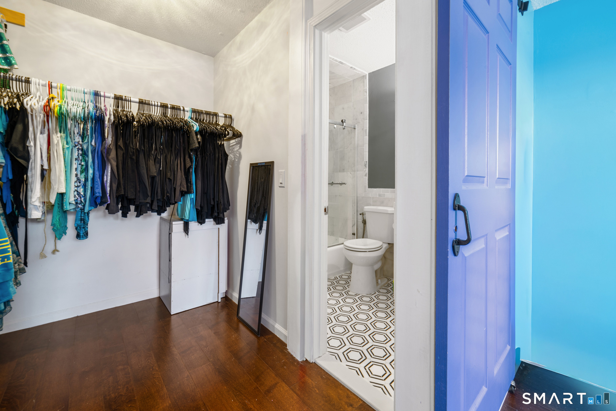 900 Mix Avenue, Unit 123 Hamden, CT 06514 - Photo 21 of 32 a bathroom with a toilet and a shower