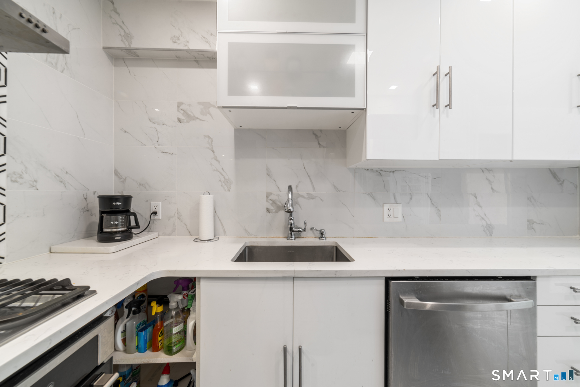 900 Mix Avenue, Unit 123 Hamden, CT 06514 - Photo 8 of 32 a kitchen with a sink and cabinets