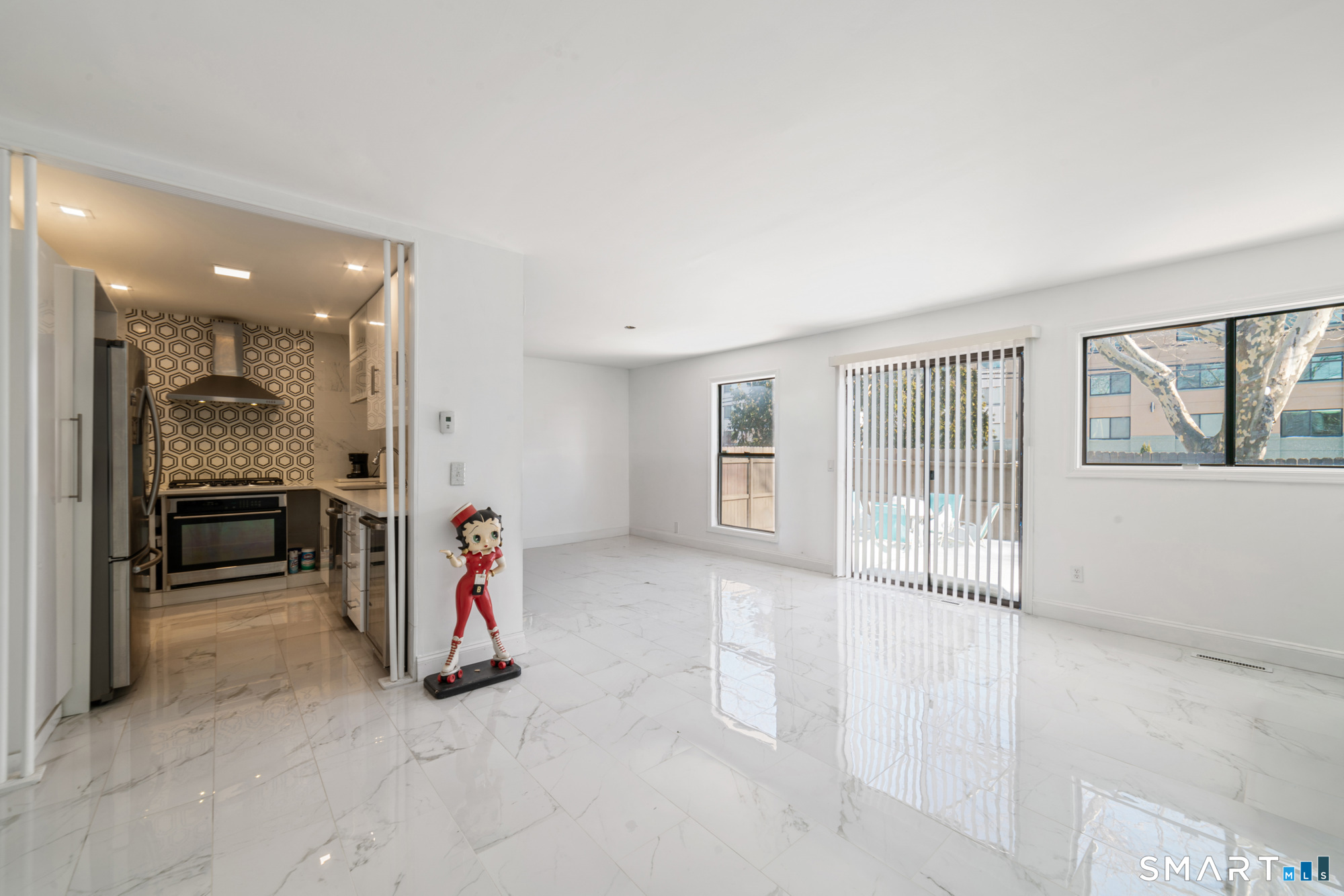 900 Mix Avenue, Unit 123 Hamden, CT 06514 - Photo 10 of 32 a view of livingroom with furniture and a table