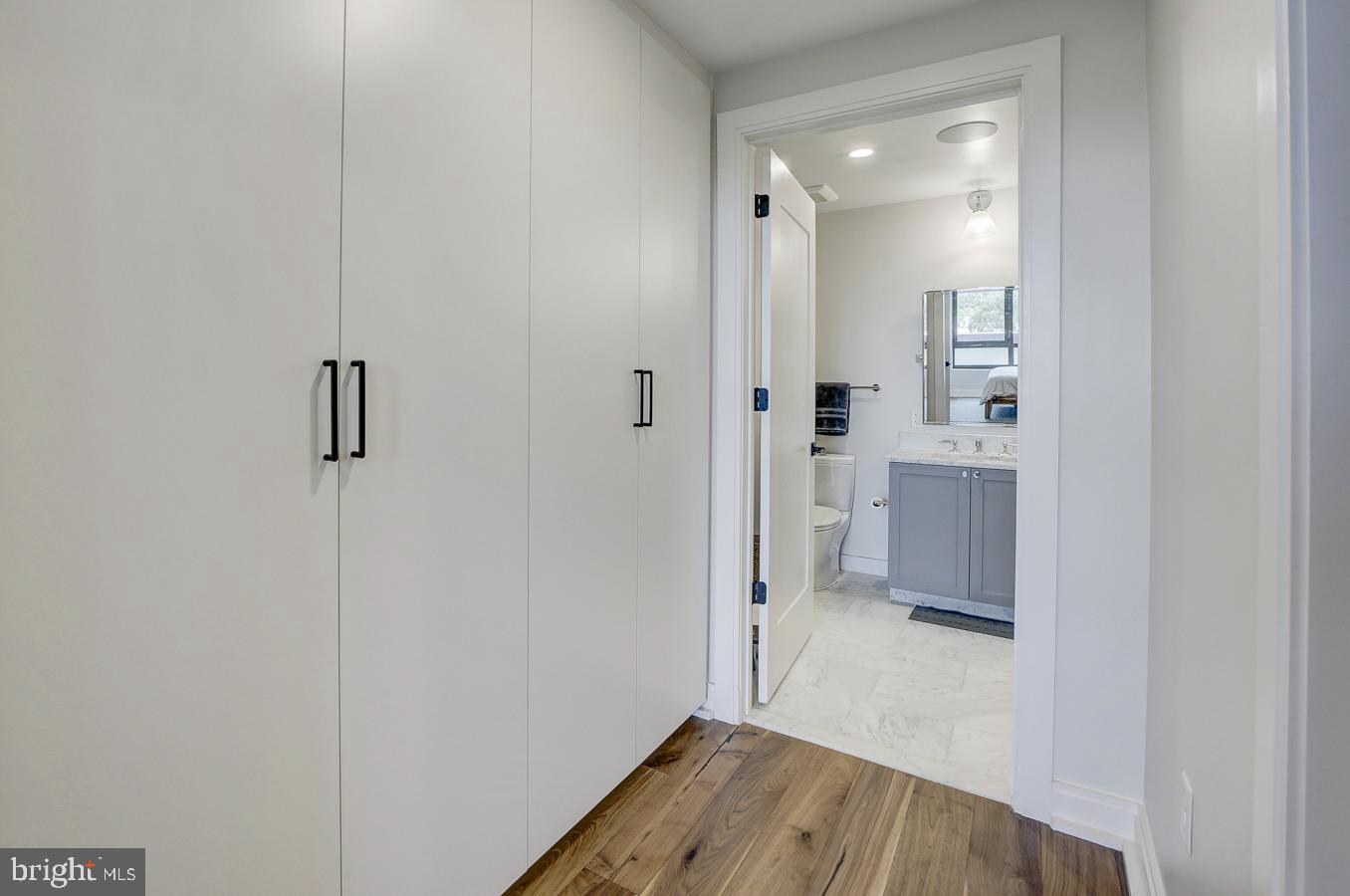 1111 Pennsylvania Ave. Southeast, Unit 409 Washington, DC 20003 - Photo 15 of 26 a view of bathroom with a toilet a sink and mirror