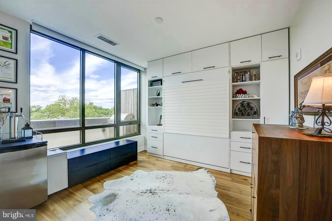 1111 Pennsylvania Ave. Southeast, Unit 409 Washington, DC 20003 - Photo 17 of 26 a view of hallway with a large window and couch