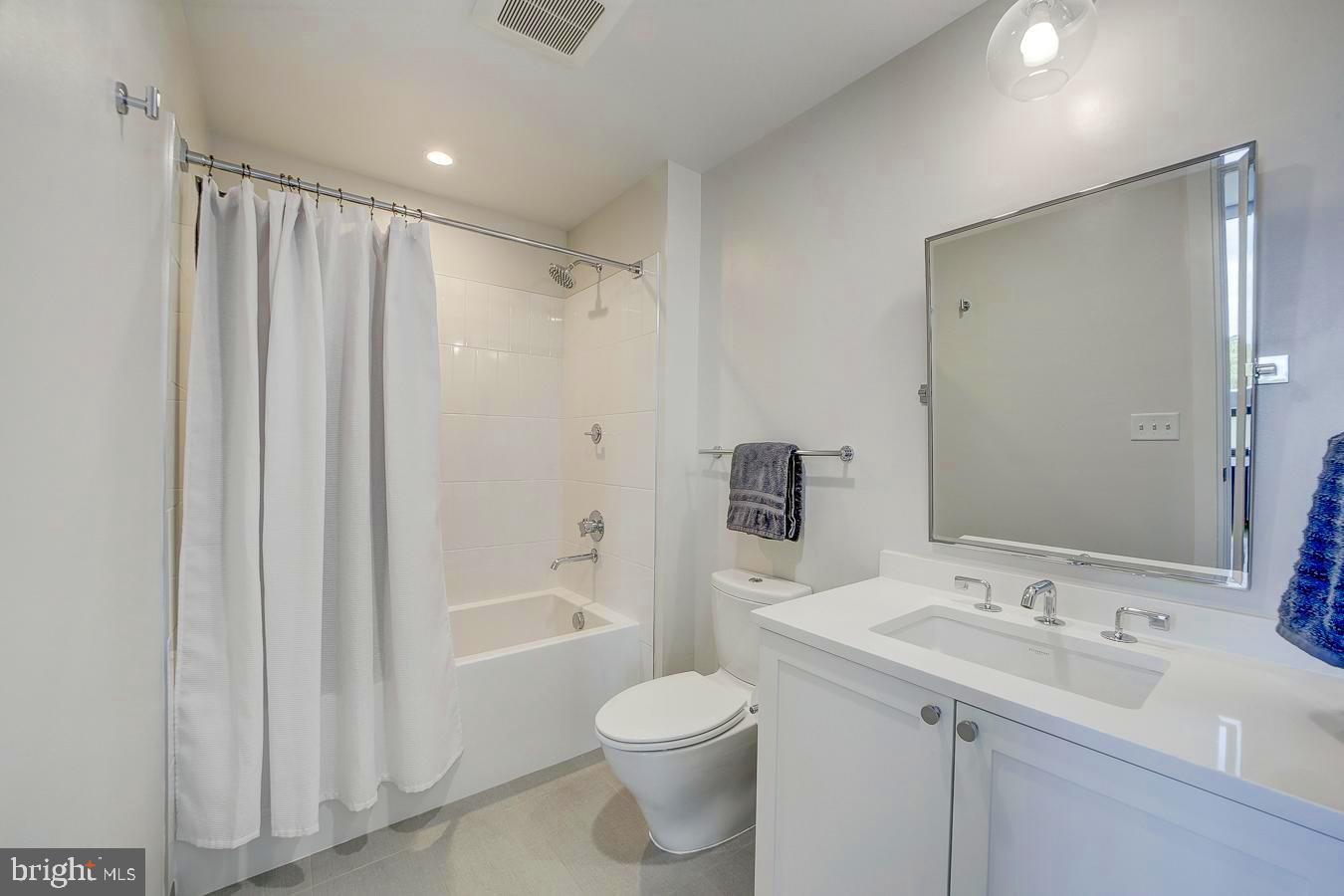 1111 Pennsylvania Ave. Southeast, Unit 409 Washington, DC 20003 - Photo 19 of 26 a bathroom with a sink toilet and shower