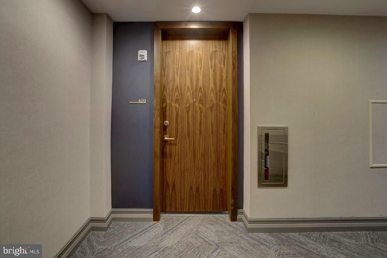 1111 Pennsylvania Ave. Southeast, Unit 409 Washington, DC 20003 - Photo 21 of 26 a view of a hallway with wooden floor