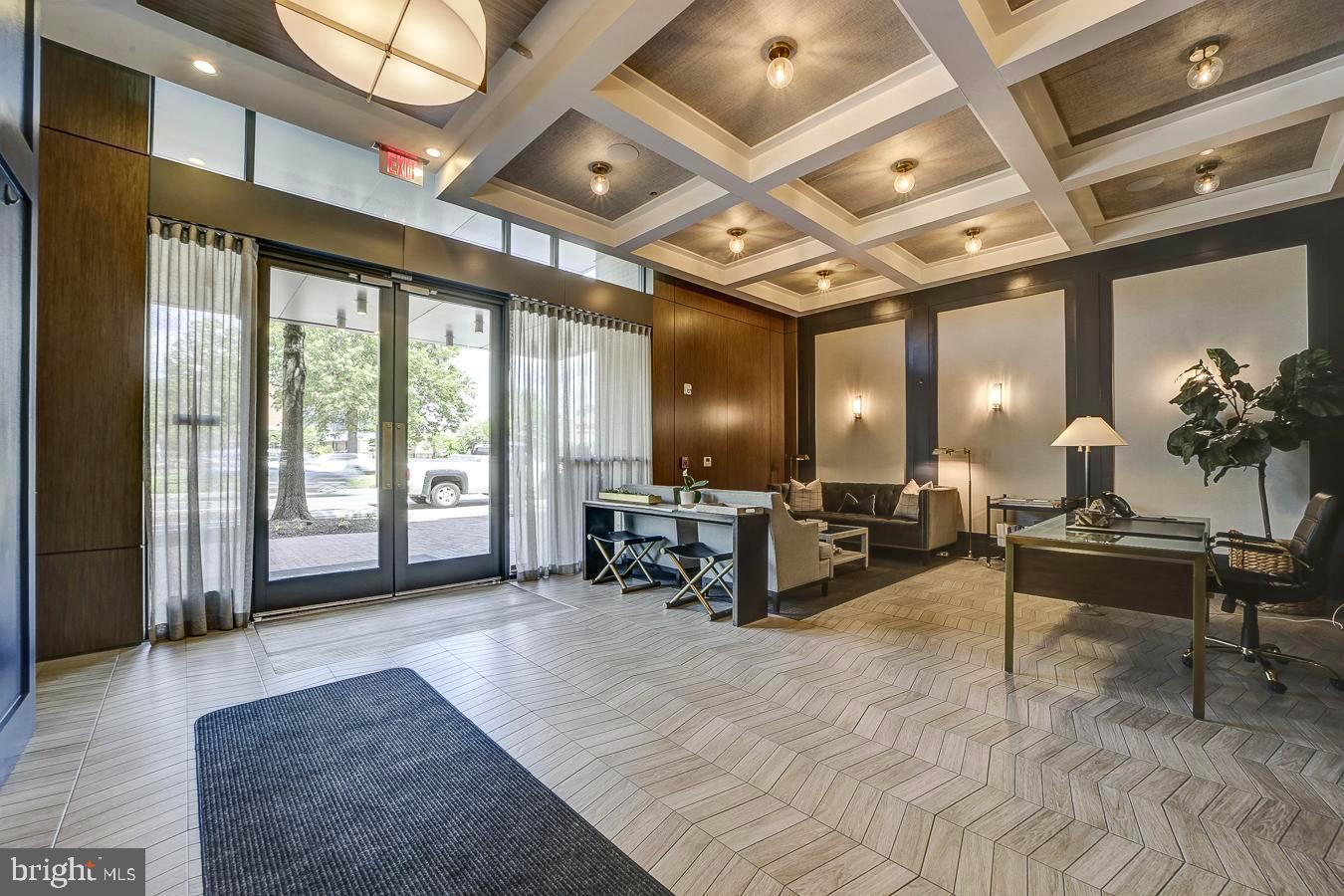 1111 Pennsylvania Ave. Southeast, Unit 409 Washington, DC 20003 - Photo 25 of 26 a living room with furniture and a large window