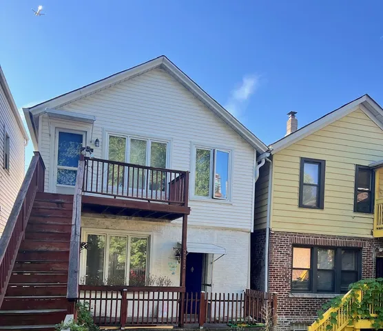 a view of a house with large windows