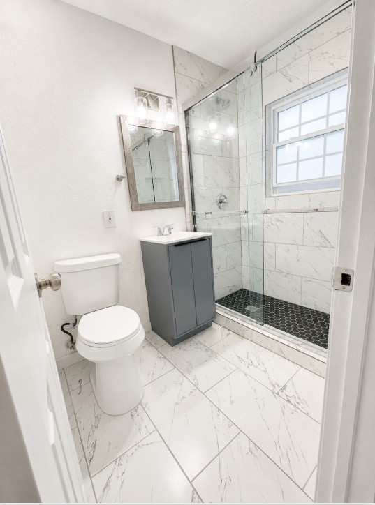 3731 Alberta Street Houston, TX 77021 - Photo 7 of 11 Beautifully updated bathroom with contemporary fixtures and clean, modern design