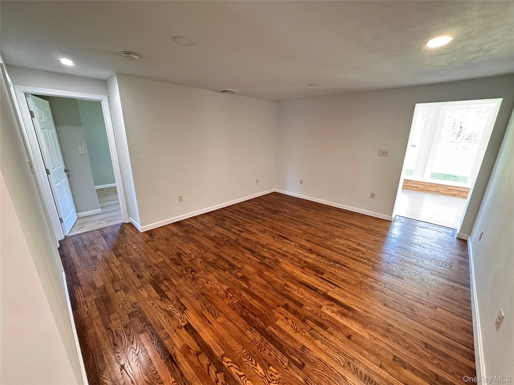 525 Plattekill Ardonia Road Wallkill, NY 12589 - Photo 11 of 25 wooden floor in an empty room with a window