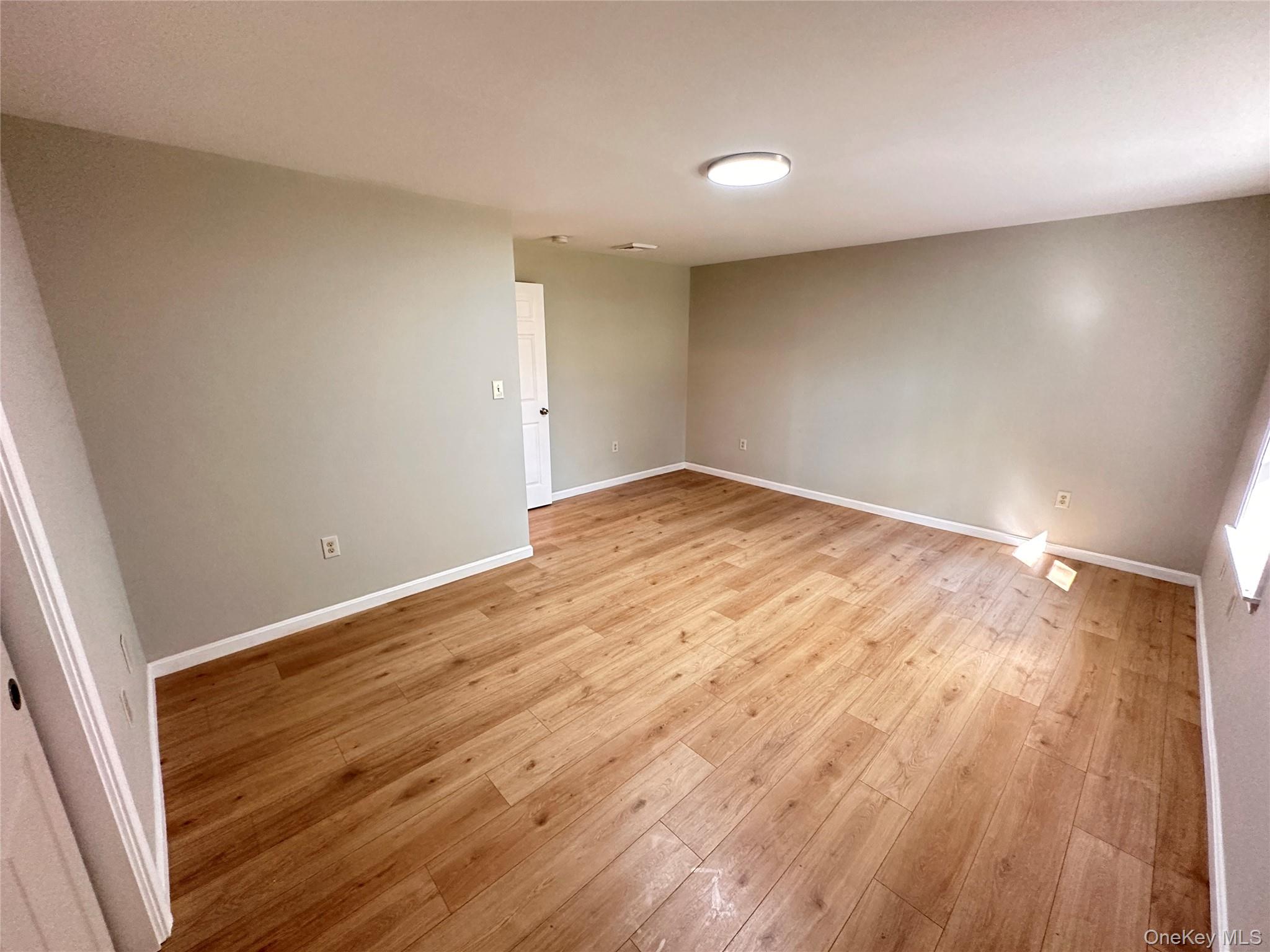 525 Plattekill Ardonia Road Wallkill, NY 12589 - Photo 15 of 25 a view of empty room with wooden floor