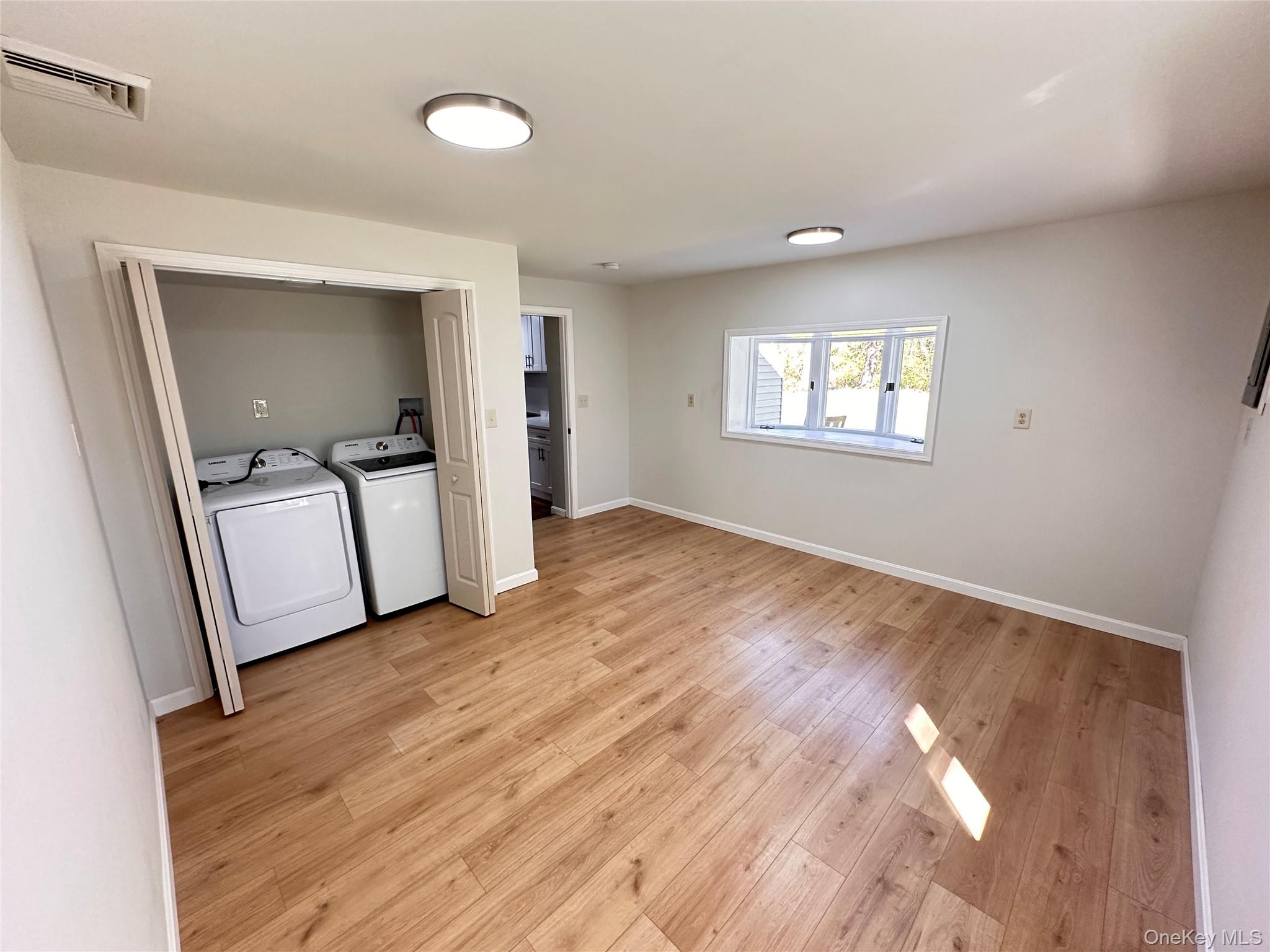 525 Plattekill Ardonia Road Wallkill, NY 12589 - Photo 18 of 25 a view of empty room with wooden floor and fan