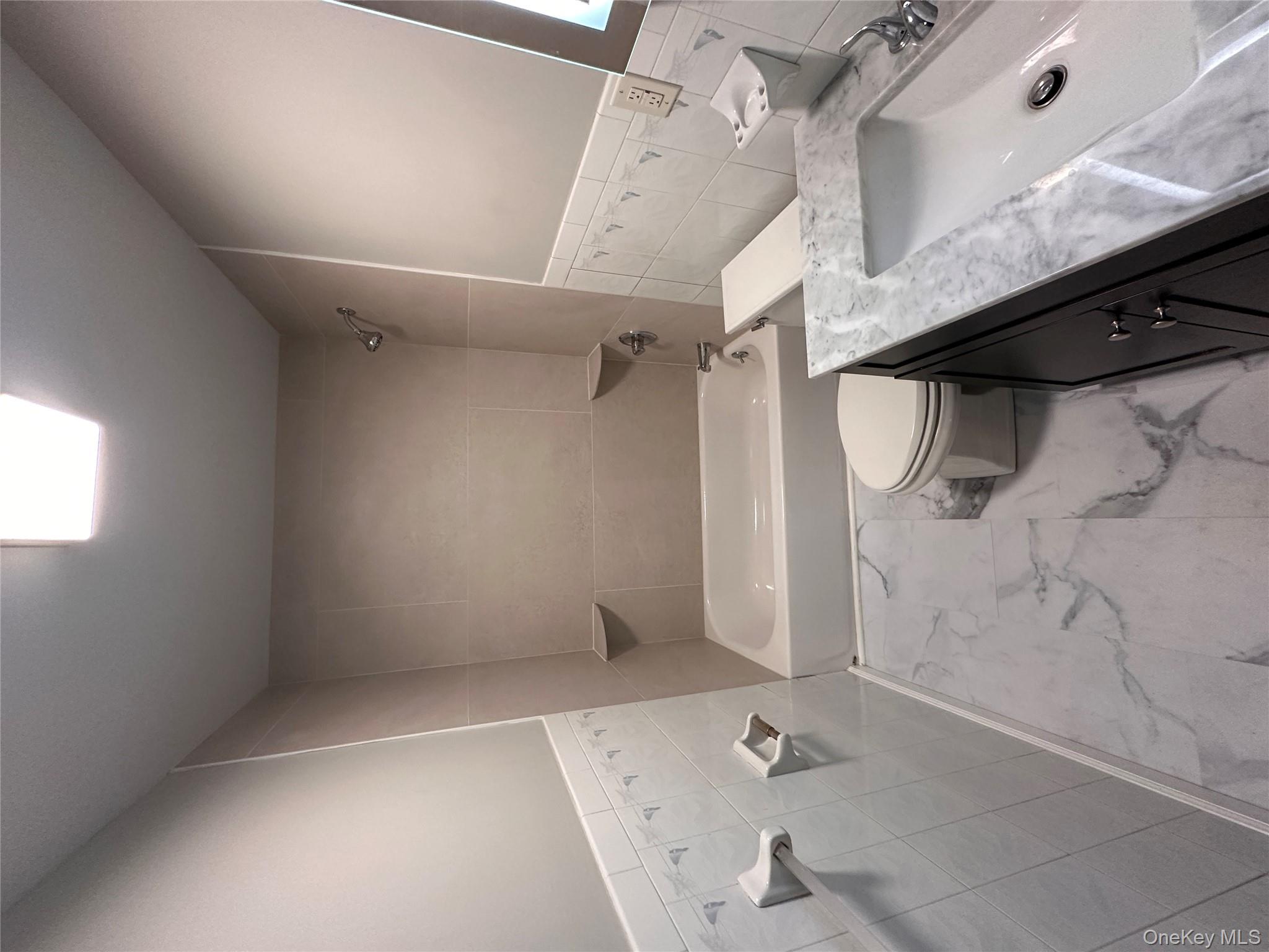 525 Plattekill Ardonia Road Wallkill, NY 12589 - Photo 19 of 25 a bathroom with a granite countertop sink a toilet and bathtub