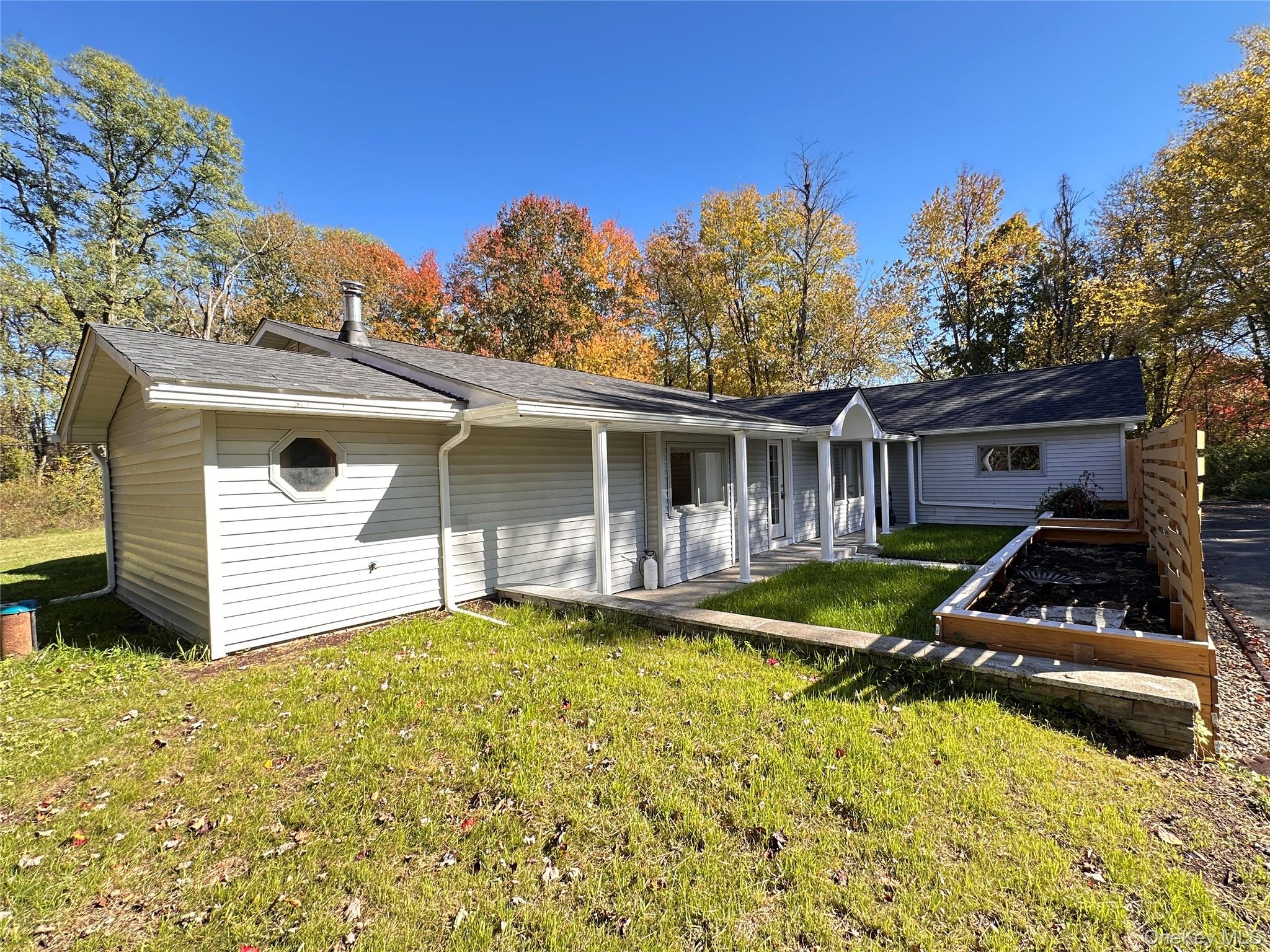 525 Plattekill Ardonia Road Wallkill, NY 12589 - Photo 23 of 25 a view of a house with pool and chairs