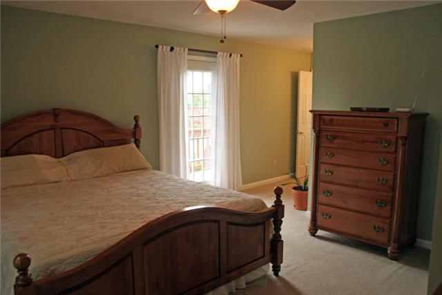 2487 Tom Anderson Road Franklin, TN 37064 - Photo 7 of 20 The large master bedroom suite has a door directly off the hot tub area of the deck.