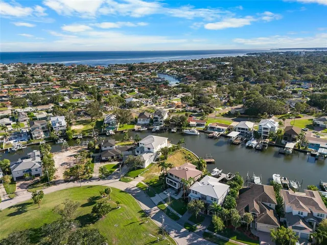 an aerial view of a city with ocean view