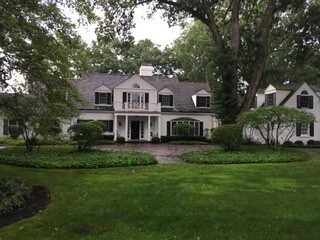 72 Woodley Road Winnetka, IL 60093 - Photo 1 of 1 a front view of a house with a garden