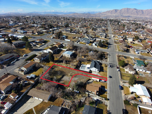 862 East 200 South Payson, UT 84651 - Photo 3 of 3 Aerial perspective of suburban area with property parcel outlined and a mountainous background