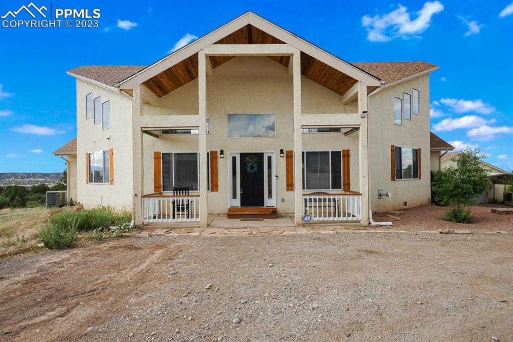 a front view of a house with large windows