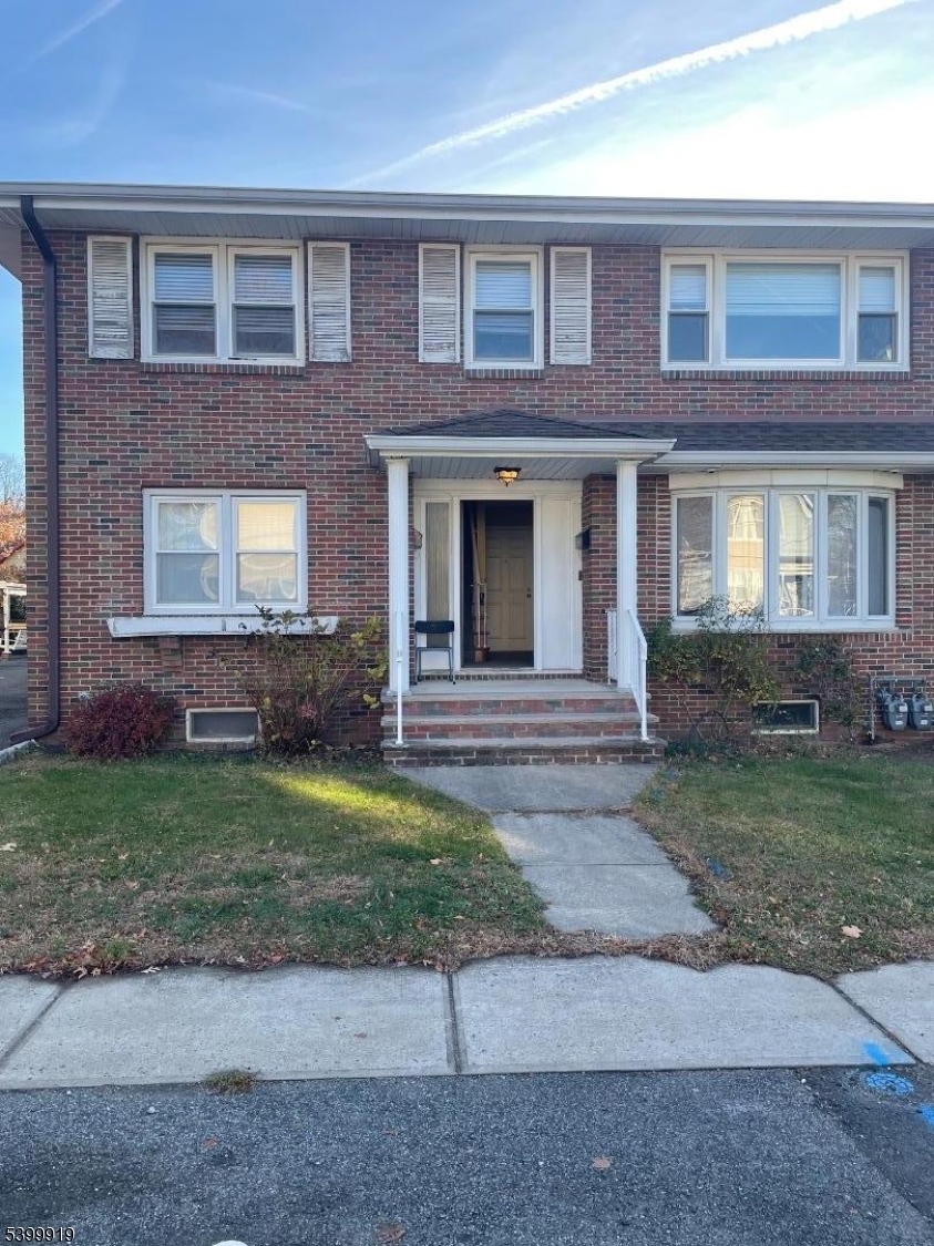113 Hawthorne Avenue, Unit 2 Hawthorne, NJ 07506 - Photo 1 of 18 a front view of a house with garden