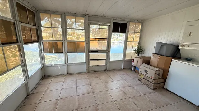a room with furniture and a large window