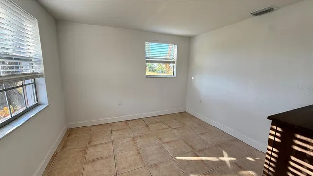 an empty room with windows