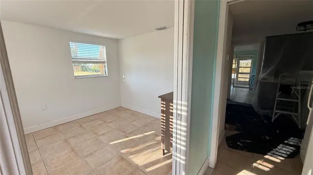 a view of an empty room and window