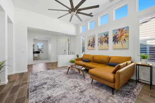 a living room with furniture and a rug