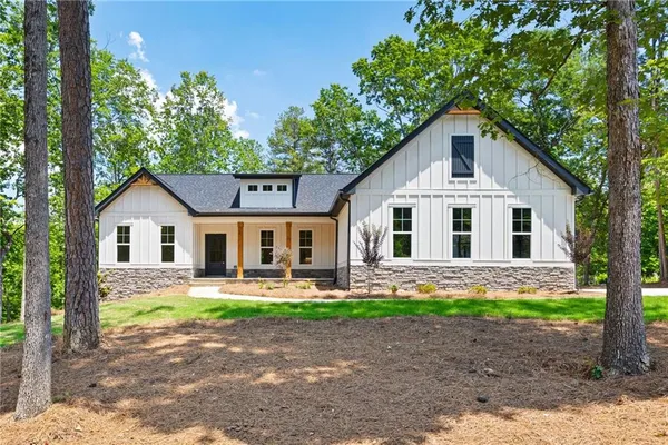 a front view of house with yard and green space