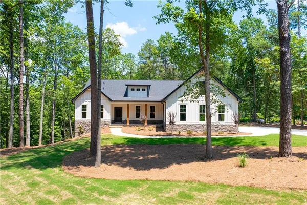 a front view of a house with a yard