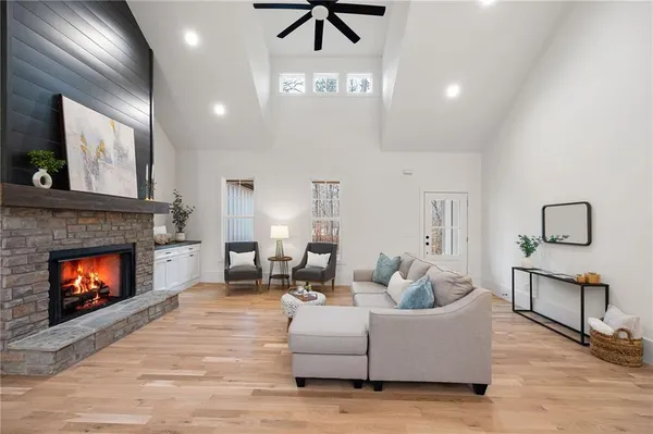 a living room with furniture and a fireplace
