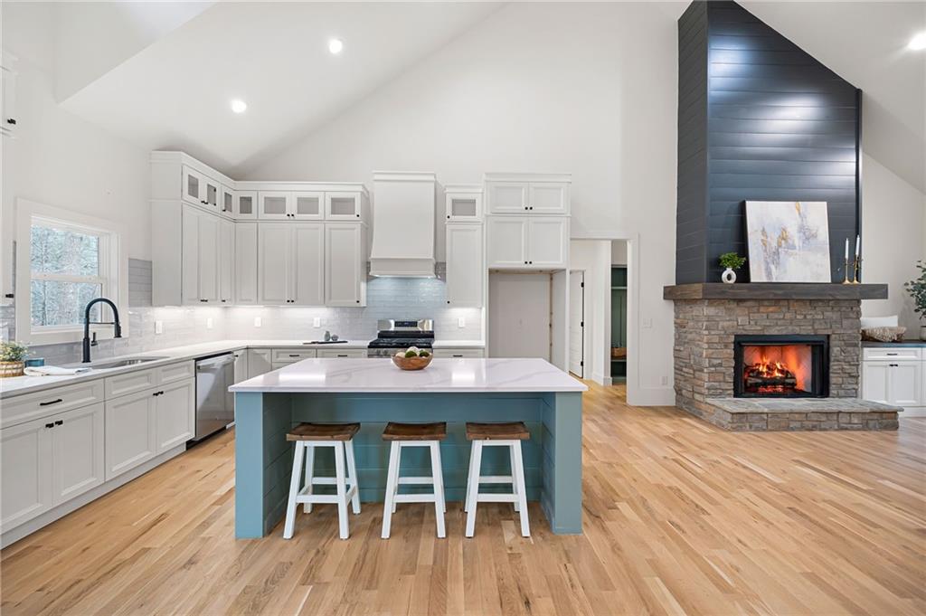 114 Folsom Road Northwest Adairsville, GA 30103 - Photo 5 of 20 a view of a kitchen with a sink and a fireplace