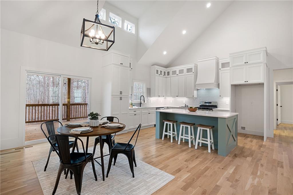 114 Folsom Road Northwest Adairsville, GA 30103 - Photo 7 of 20 a view of a dining room with furniture and wooden floor