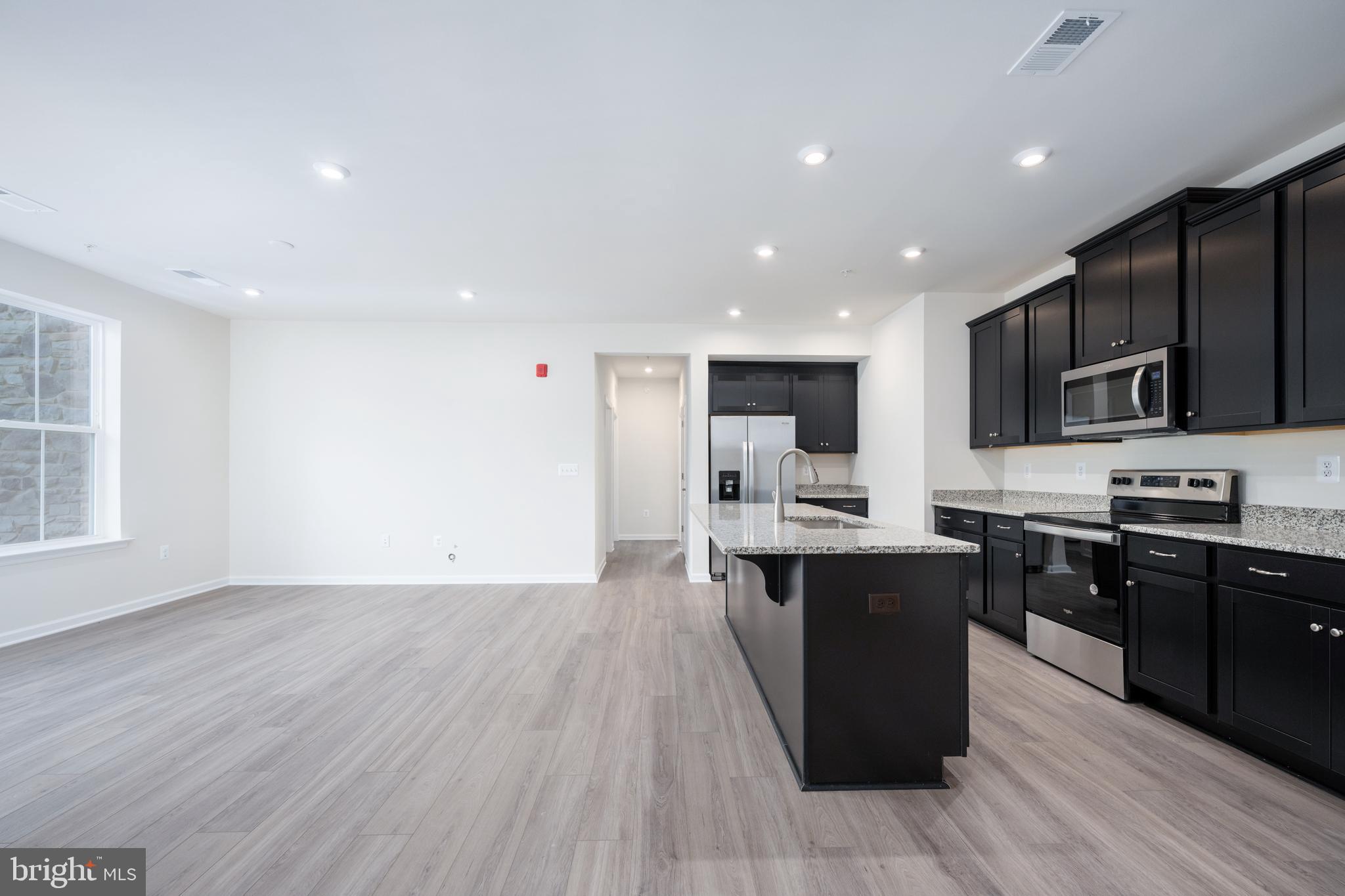 29 Hyssop Way, Unit 101 Stafford, VA 22554 - Photo 11 of 34 a large kitchen with stainless steel appliances lots of counter space a sink and a dishwasher
