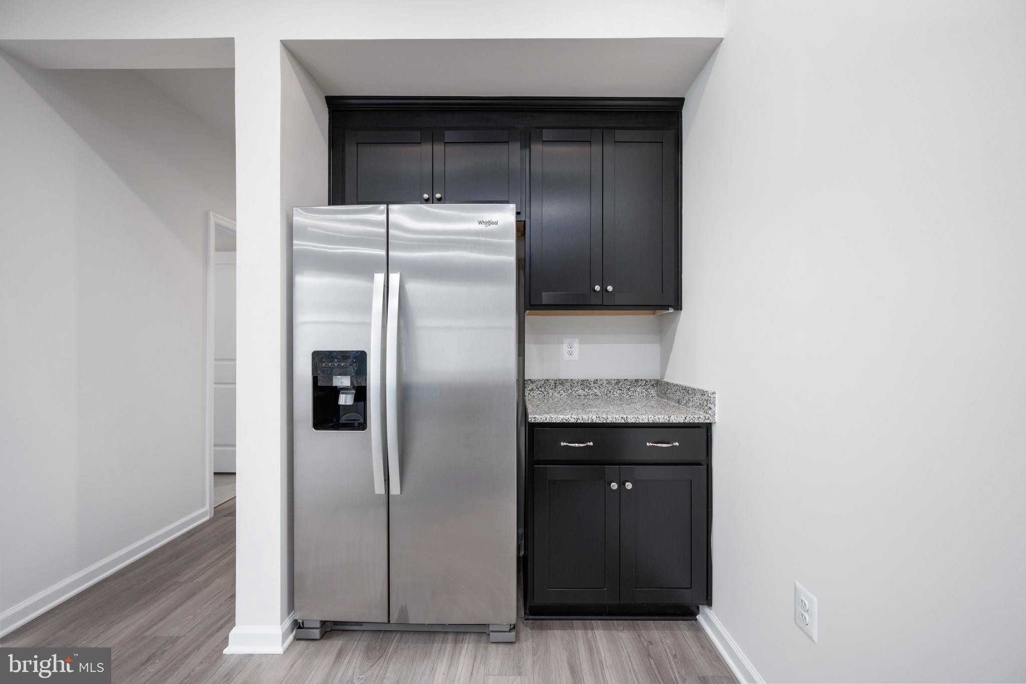 29 Hyssop Way, Unit 101 Stafford, VA 22554 - Photo 19 of 34 a kitchen with a refrigerator and a sink