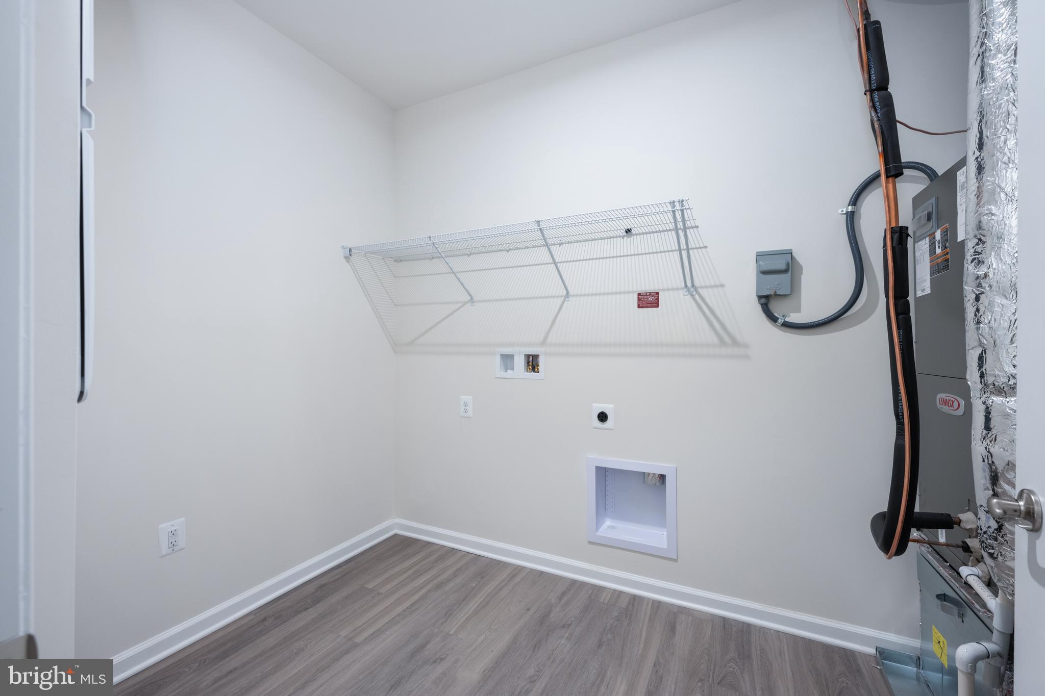 29 Hyssop Way, Unit 101 Stafford, VA 22554 - Photo 22 of 34 a view of storage and utility room with racks on the wall