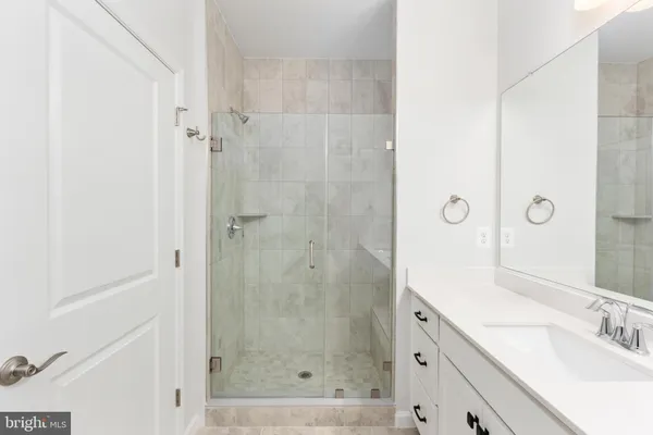 a bathroom with a double vanity sink and mirror